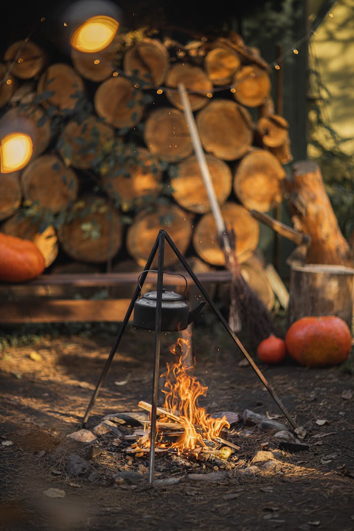 Heating A Kettle With Burning Firewood